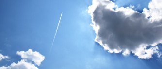 jet stream and sun behind clouds